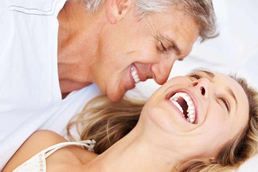 Happy woman with a middle-aged man without potency problems